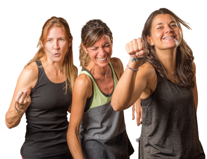 portrait-three-sportswoman-showing-closed-fists-funny-way-gym-concept-people-gym 1